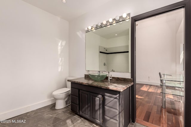 1330 W Panorama Rd, Tucson, AZ 85704 - bathroom with recessed lighting, baseboards, vanity, and toilet