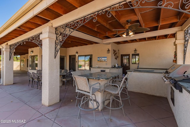 1330 W Panorama Rd, Tucson, AZ 85704 - view of patio featuring a ceiling fan, outdoor dining area, and exterior kitchen
