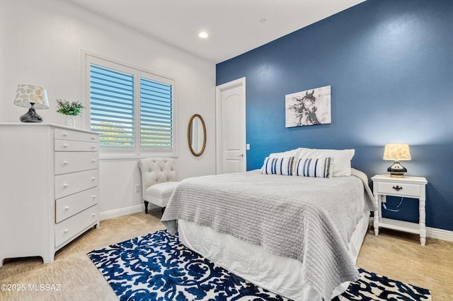 bedroom with light colored carpet, recessed lighting, and baseboards