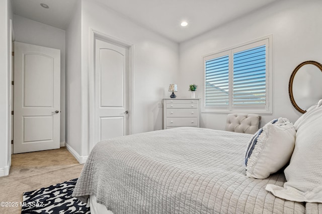bedroom featuring recessed lighting, baseboards, and light carpet