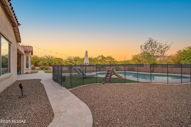 exterior space with a fenced in pool, a patio area, and fence