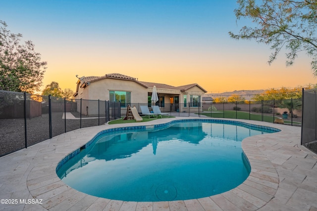 view of swimming pool with a fenced in pool and a fenced backyard