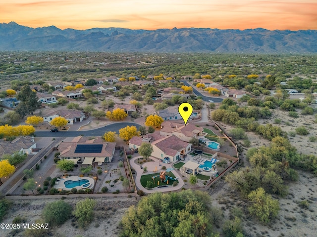 aerial view at dusk with a residential view and a mountain view