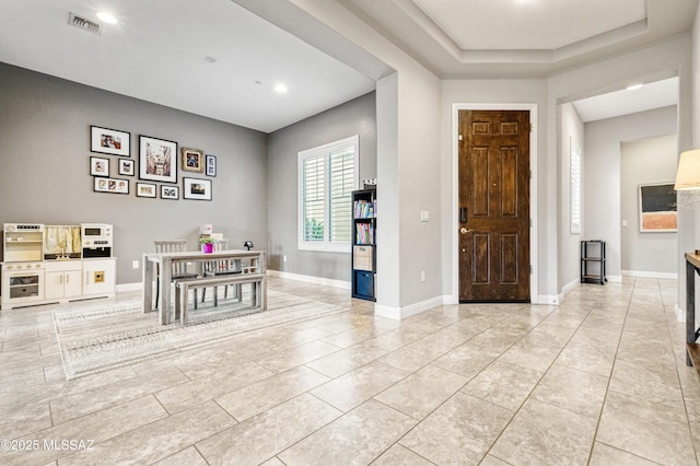 entrance foyer featuring recessed lighting, baseboards, visible vents, and light tile patterned floors