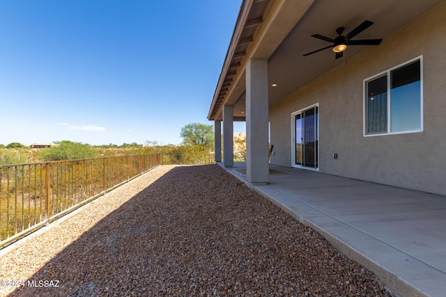 view of yard with a patio, ceiling fan, and a fenced backyard