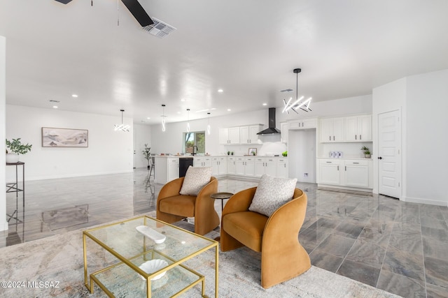 living room featuring marble finish floor, ceiling fan with notable chandelier, recessed lighting, baseboards, and visible vents