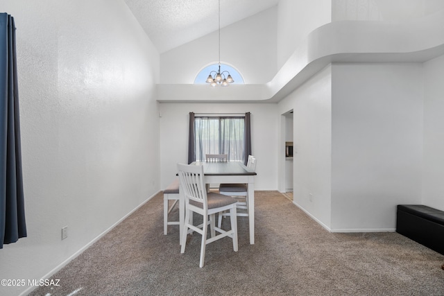 carpeted dining space featuring an inviting chandelier and vaulted ceiling