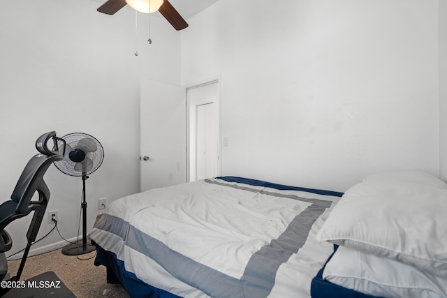 bedroom featuring baseboards and a ceiling fan