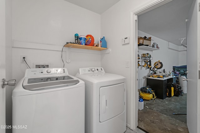 laundry area featuring separate washer and dryer and laundry area