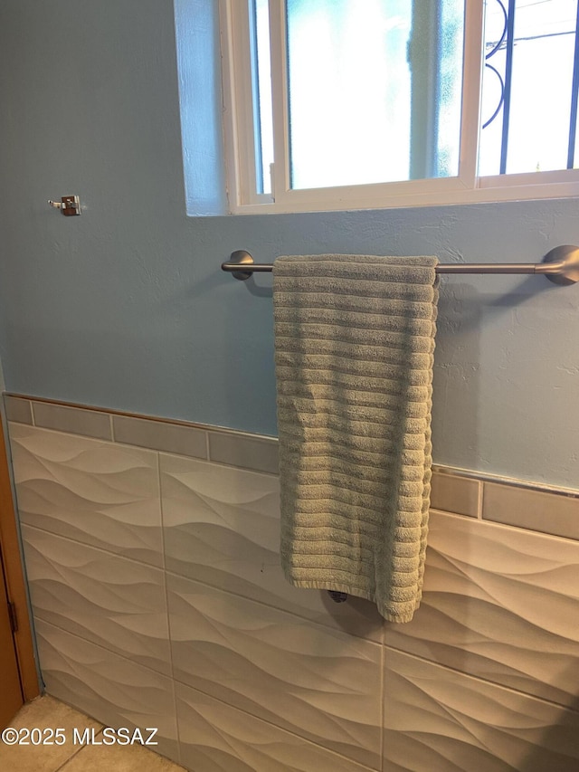 bathroom with tile walls and wainscoting