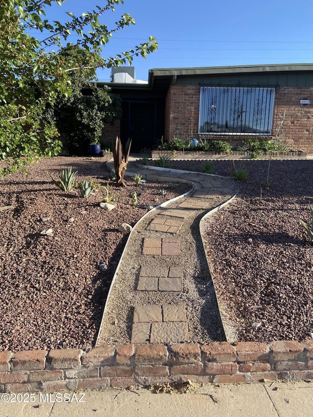 exterior space with brick siding