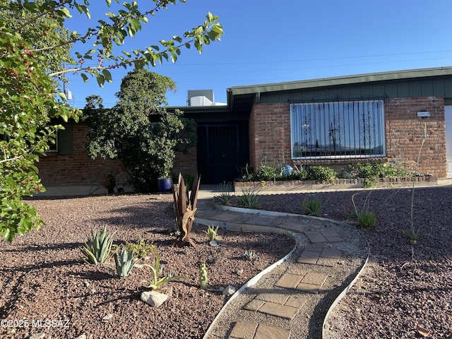 ranch-style home with brick siding
