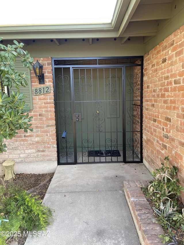 entrance to property with brick siding