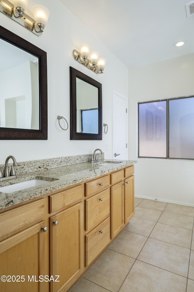 full bath with visible vents, a sink, tile patterned floors, and double vanity