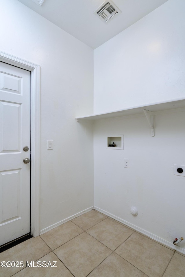 laundry area with laundry area, visible vents, hookup for a washing machine, light tile patterned floors, and hookup for a gas dryer