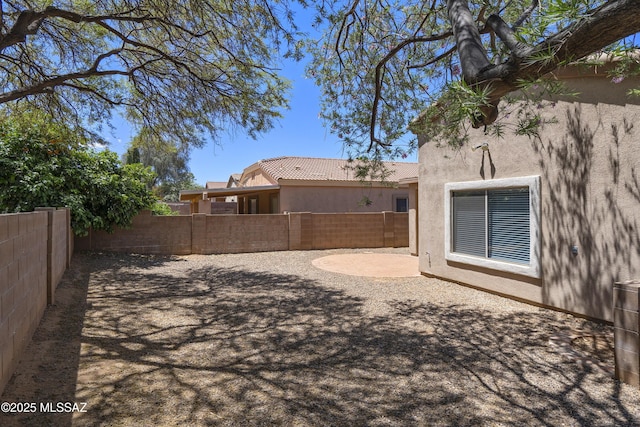 view of yard with a fenced backyard and a patio area