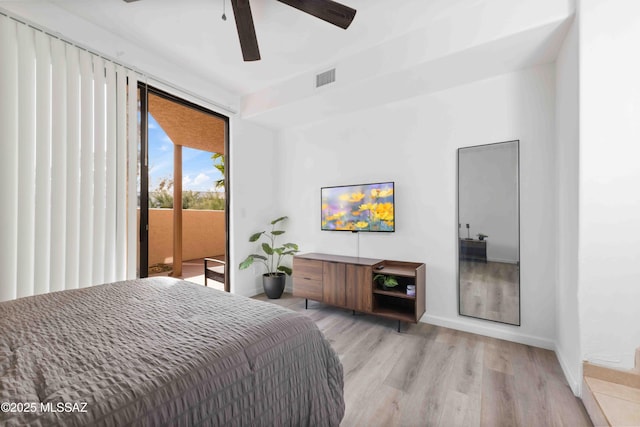 5675 N Camino Esplendora Unit 1103, Tucson, AZ 85718 - bedroom with access to exterior, baseboards, light wood-style floors, and ceiling fan
