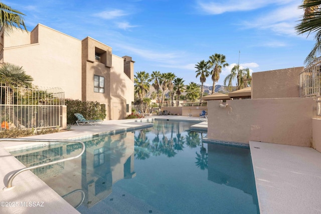 5675 N Camino Esplendora Unit 1103, Tucson, AZ 85718 - community pool with fence and a patio area