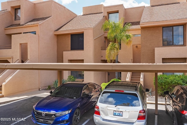 5675 N Camino Esplendora Unit 1103, Tucson, AZ 85718 - view of front of property featuring covered parking and stucco siding