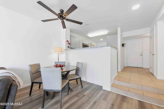 5675 N Camino Esplendora Unit 1103, Tucson, AZ 85718 - dining room with ceiling fan, light wood finished floors, recessed lighting, and baseboards