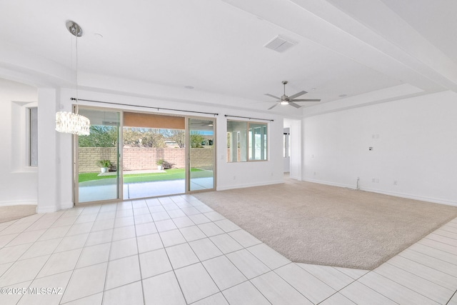 unfurnished room featuring light tile patterned flooring, light carpet, ceiling fan with notable chandelier, baseboards, and visible vents