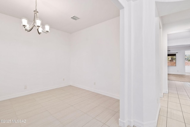 empty room with visible vents, arched walkways, light tile patterned floors, baseboards, and an inviting chandelier