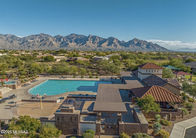 birds eye view of property with a mountain view