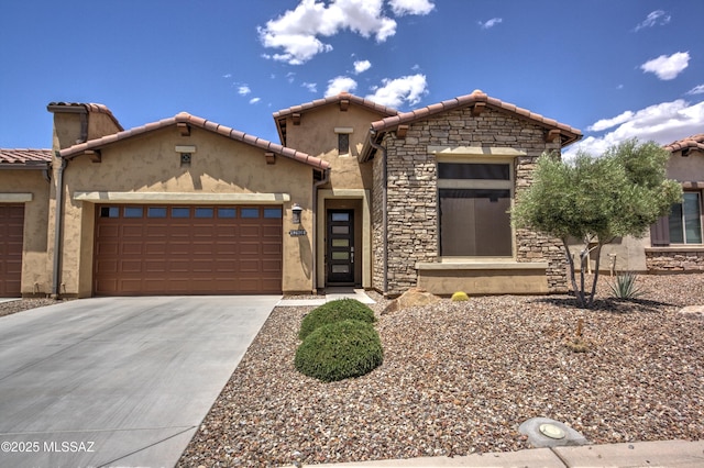 62908 E Thunder Rock Dr, Tucson, AZ 85739 - mediterranean / spanish-style home with an attached garage, stone siding, a tiled roof, stucco siding, and driveway