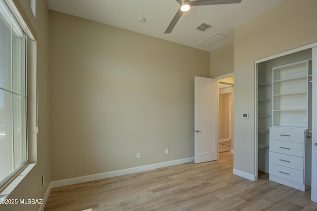 62908 E Thunder Rock Dr, Tucson, AZ 85739 - unfurnished bedroom featuring baseboards, light wood-style flooring, visible vents, and a ceiling fan