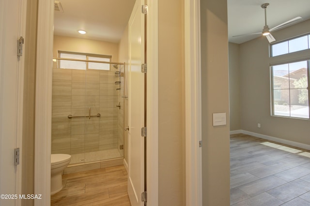 62908 E Thunder Rock Dr, Tucson, AZ 85739 - bathroom with a ceiling fan, toilet, visible vents, and a shower stall