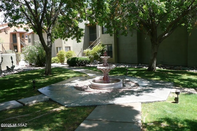 view of property's community featuring stairs
