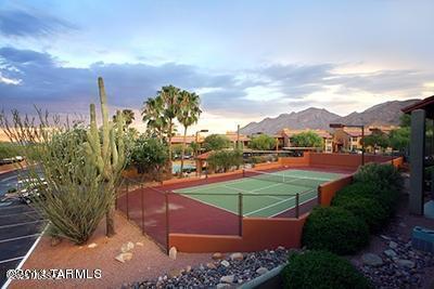view of tennis court with a mountain view