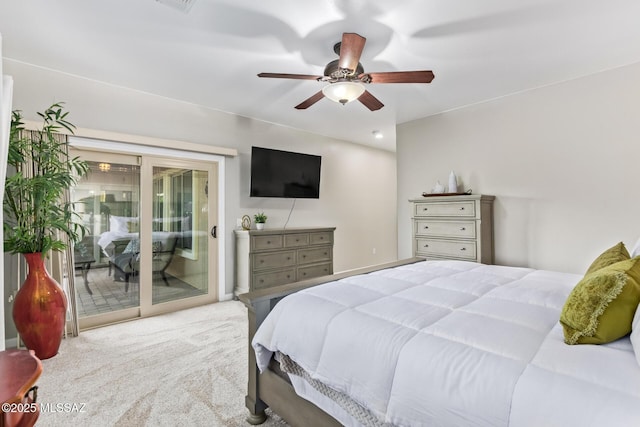carpeted bedroom featuring a ceiling fan, visible vents, and access to exterior