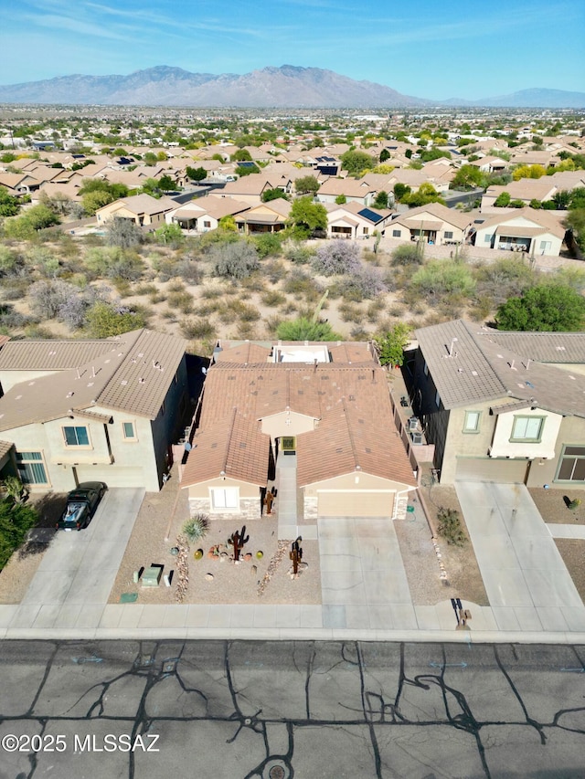drone / aerial view with a residential view and a mountain view
