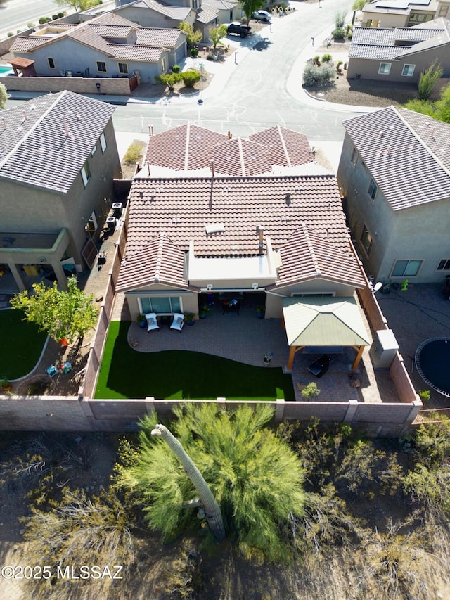 birds eye view of property with a residential view