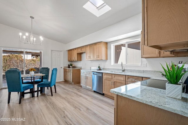 9453 E Pena Dr, Tucson, AZ 85730 - kitchen featuring light stone countertops, dishwasher, a sink, lofted ceiling with skylight, and a notable chandelier