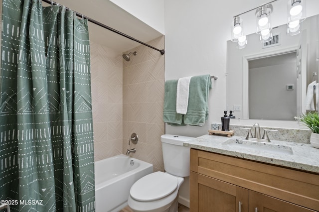 9453 E Pena Dr, Tucson, AZ 85730 - full bathroom featuring vanity, shower / bath combo with shower curtain, toilet, and visible vents