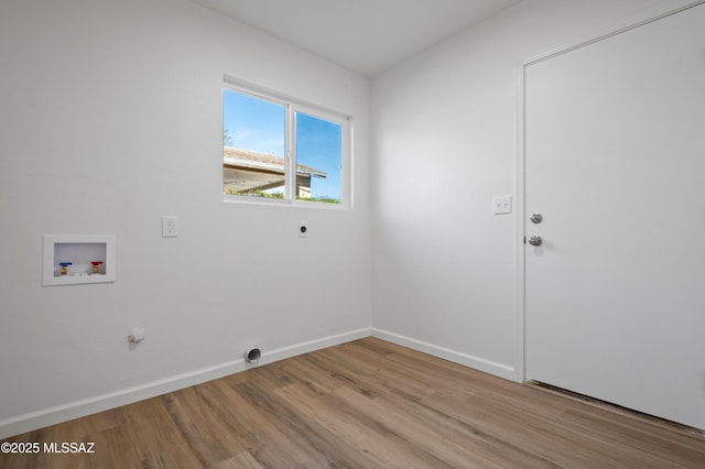 9453 E Pena Dr, Tucson, AZ 85730 - laundry room featuring washer hookup, laundry area, baseboards, electric dryer hookup, and light wood-type flooring