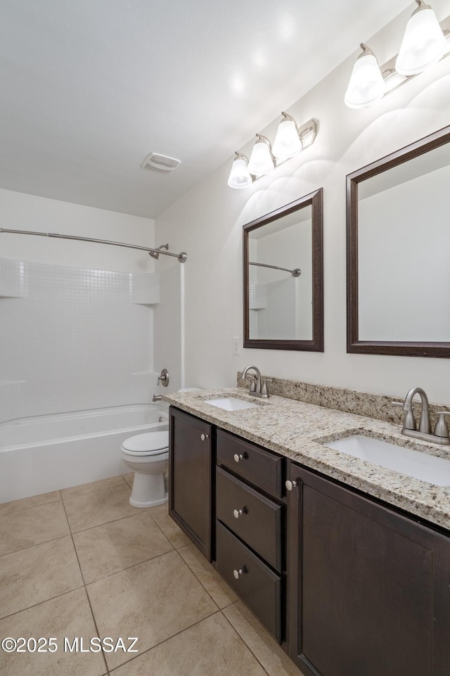 full bath featuring toilet, double vanity, tile patterned floors, and tub / shower combination