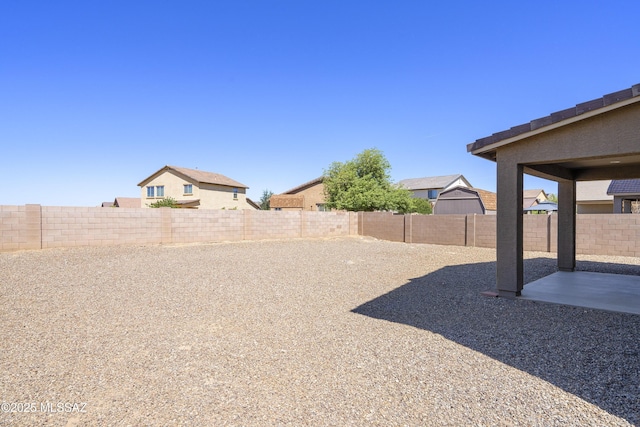 fenced backyard featuring a patio area