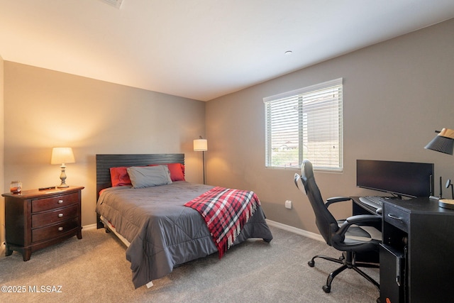 bedroom featuring baseboards and carpet flooring