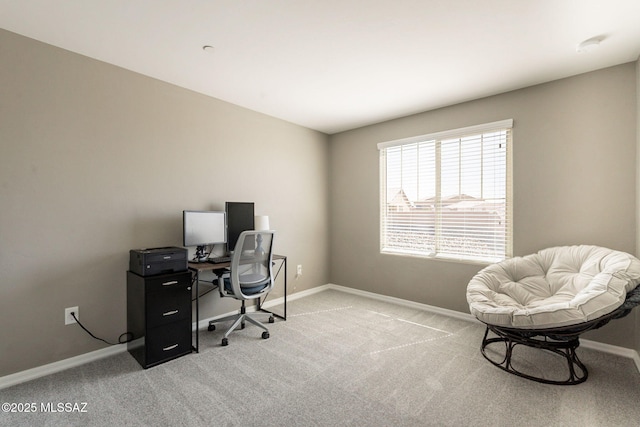 home office with light carpet and baseboards