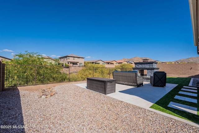 view of patio / terrace with a residential view and a fenced backyard