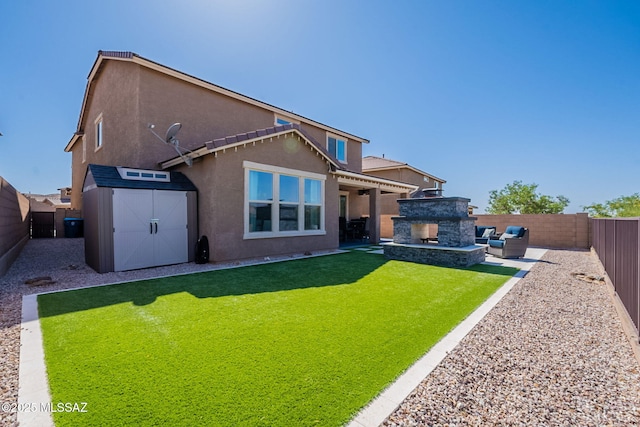 rear view of property featuring a fenced backyard, a patio, stucco siding, and a storage unit
