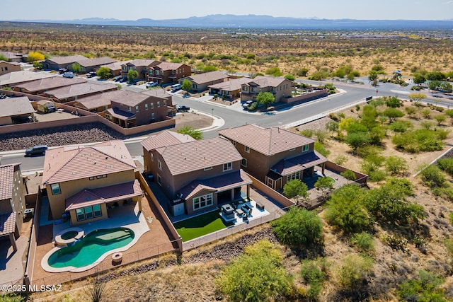 drone / aerial view featuring a mountain view and a residential view