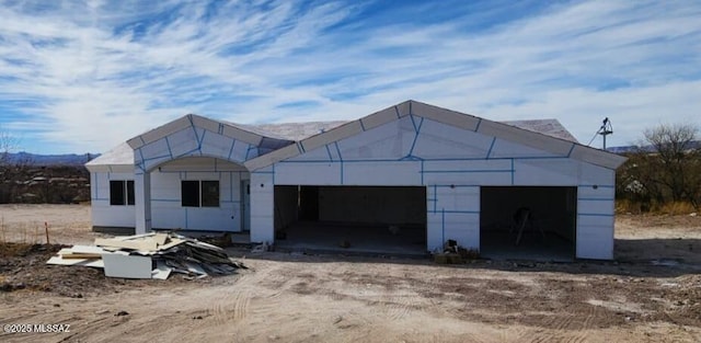 property in mid-construction with a garage