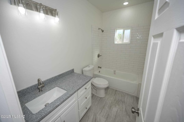 bathroom with vanity, toilet, and shower / washtub combination