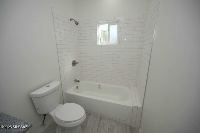 full bathroom with toilet and shower / tub combination