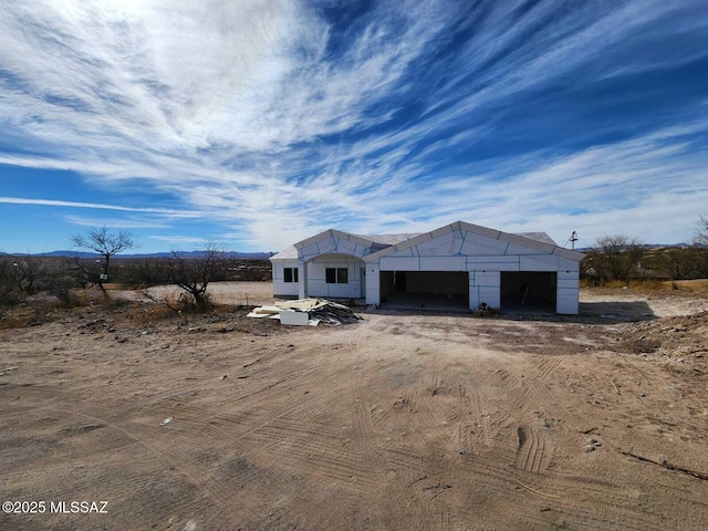 unfinished property with an outdoor structure and an outbuilding
