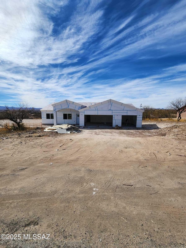 property under construction with a garage